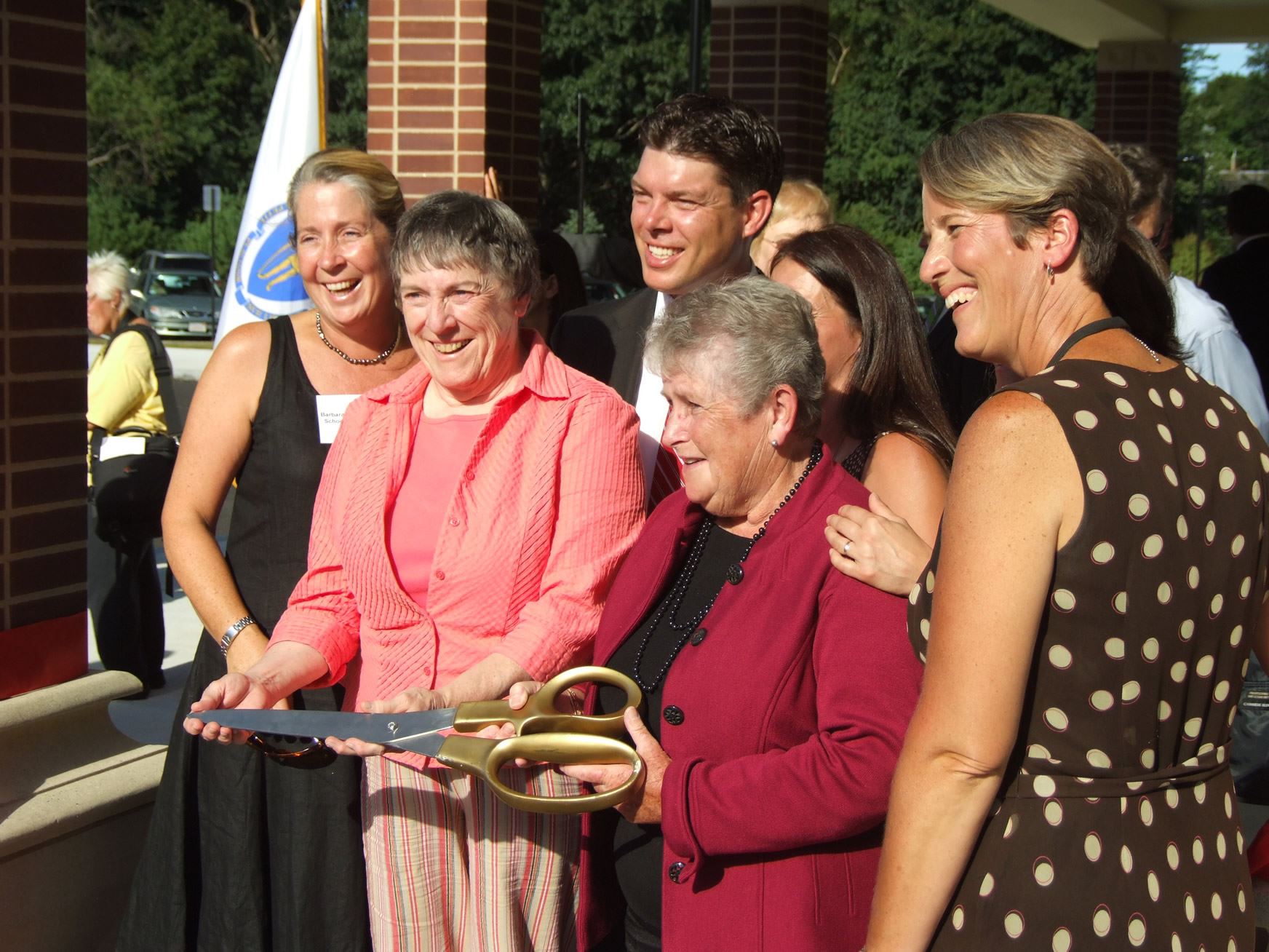 Attendees Holding Ribboncutting Scissors
